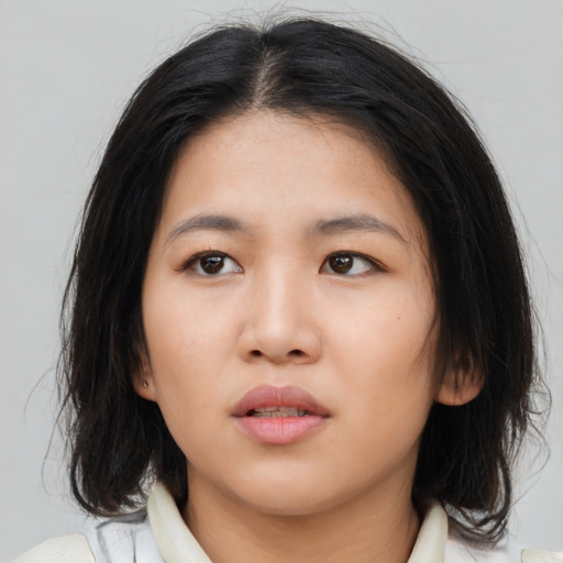 Neutral asian young-adult female with medium  brown hair and brown eyes