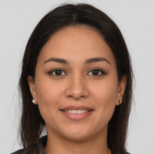 Joyful white young-adult female with long  brown hair and brown eyes