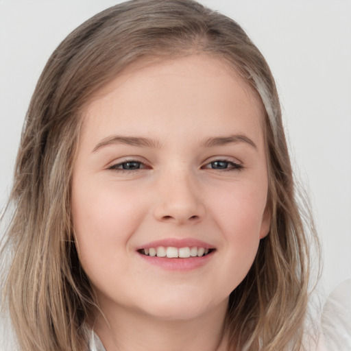 Joyful white child female with medium  brown hair and grey eyes