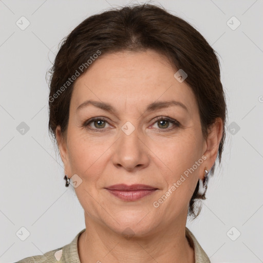 Joyful white adult female with medium  brown hair and grey eyes