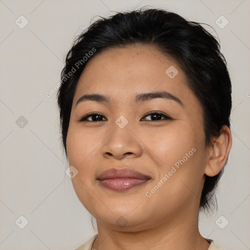 Joyful asian young-adult female with medium  black hair and brown eyes