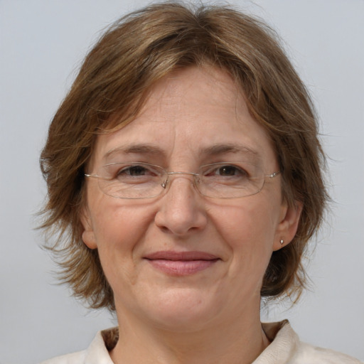 Joyful white middle-aged female with medium  brown hair and brown eyes