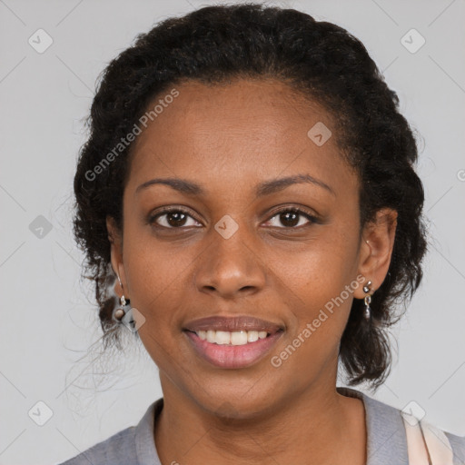 Joyful black adult female with short  brown hair and brown eyes