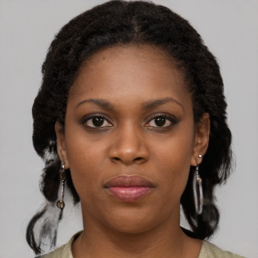 Joyful black young-adult female with medium  black hair and brown eyes