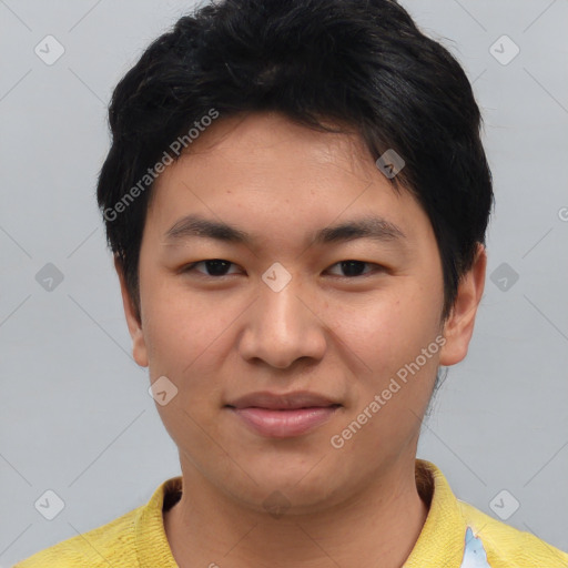 Joyful asian young-adult male with short  black hair and brown eyes