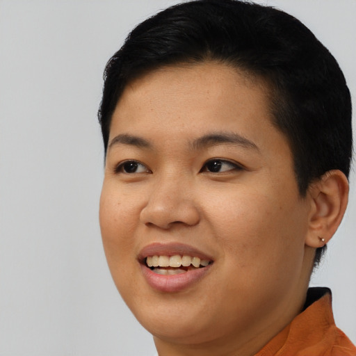 Joyful asian young-adult female with short  black hair and brown eyes