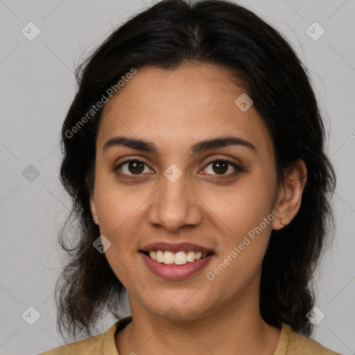 Joyful latino young-adult female with medium  brown hair and brown eyes