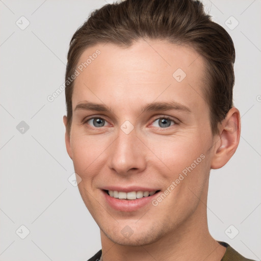 Joyful white young-adult female with short  brown hair and grey eyes