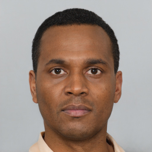 Neutral black young-adult male with short  black hair and brown eyes