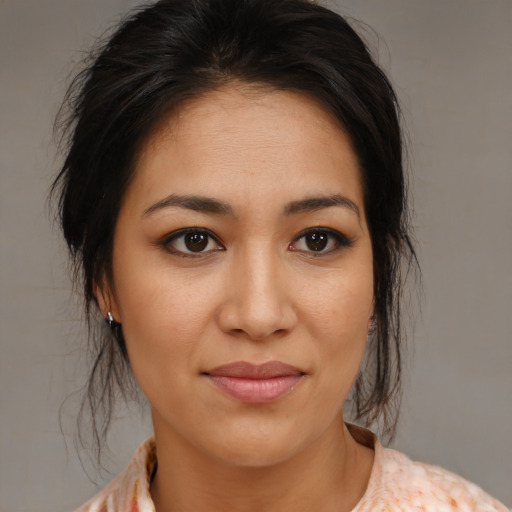 Joyful asian young-adult female with medium  brown hair and brown eyes