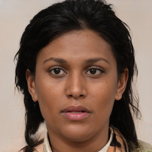 Neutral latino young-adult female with medium  brown hair and brown eyes