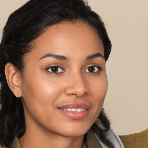 Joyful latino young-adult female with long  brown hair and brown eyes