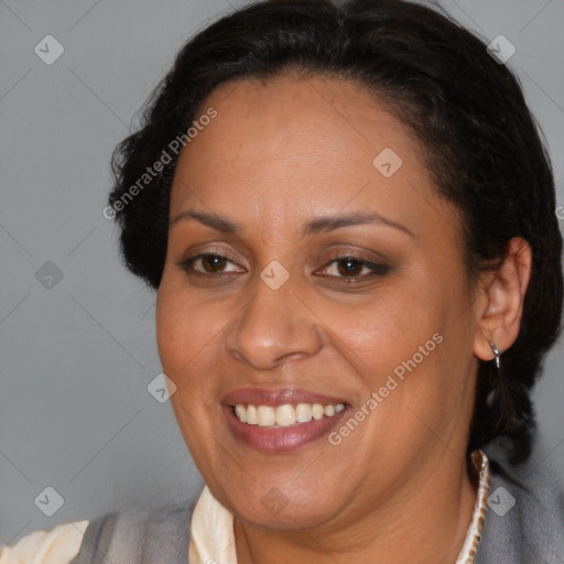 Joyful latino adult female with medium  brown hair and brown eyes