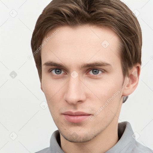 Neutral white young-adult male with short  brown hair and grey eyes