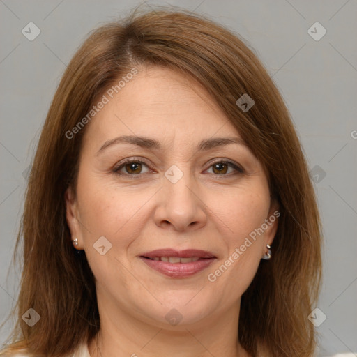 Joyful white adult female with medium  brown hair and brown eyes