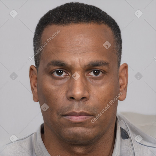 Neutral latino adult male with short  brown hair and brown eyes