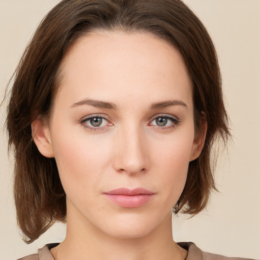 Neutral white young-adult female with medium  brown hair and green eyes