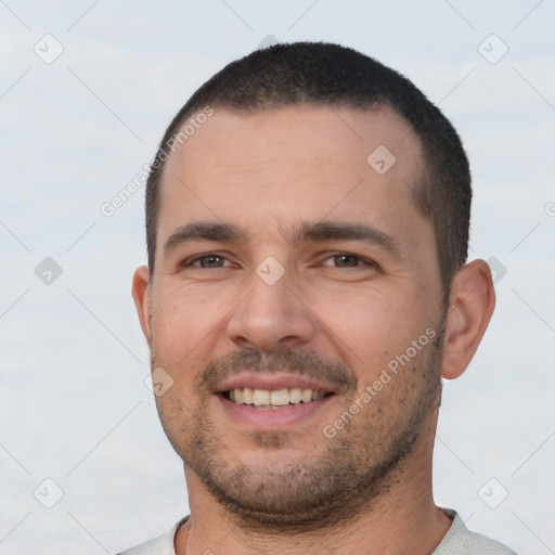 Joyful white young-adult male with short  black hair and brown eyes