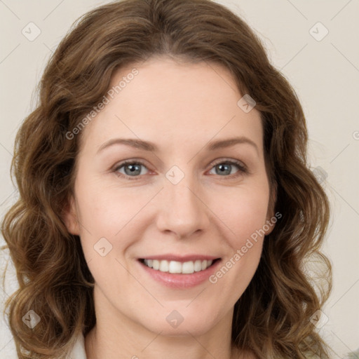 Joyful white young-adult female with long  brown hair and green eyes