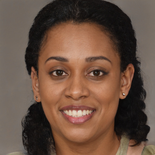 Joyful latino young-adult female with medium  black hair and brown eyes