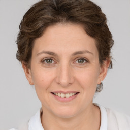 Joyful white adult female with short  brown hair and brown eyes