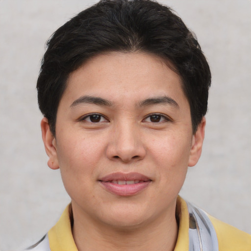 Joyful asian young-adult female with short  brown hair and brown eyes