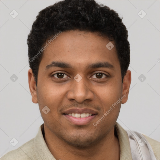 Joyful black young-adult male with short  brown hair and brown eyes