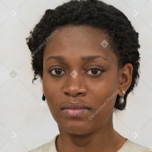 Neutral black young-adult female with short  brown hair and brown eyes