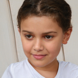 Joyful white child female with short  brown hair and brown eyes