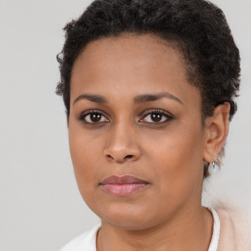 Neutral black young-adult female with short  brown hair and brown eyes