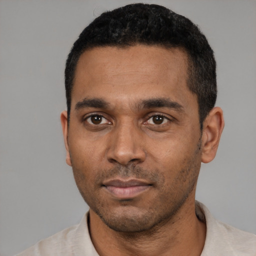 Neutral black young-adult male with short  black hair and brown eyes