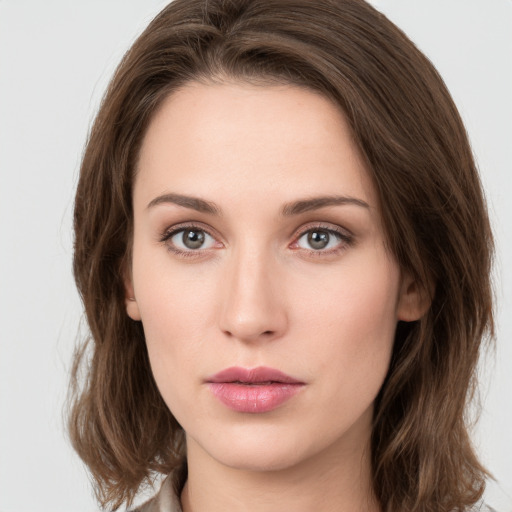 Neutral white young-adult female with medium  brown hair and green eyes