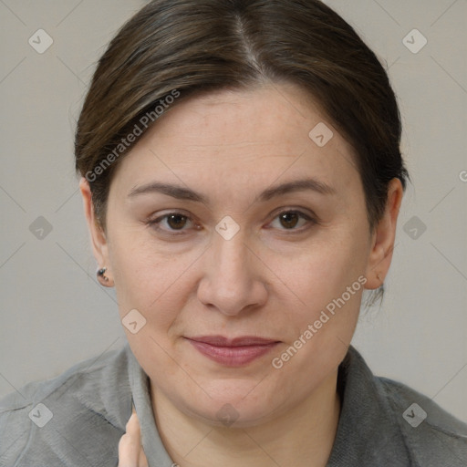 Joyful white adult female with short  brown hair and brown eyes