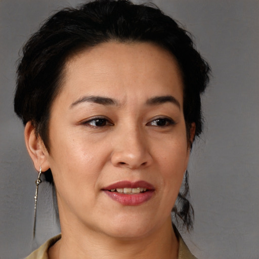 Joyful black adult female with short  brown hair and brown eyes