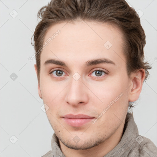 Neutral white young-adult male with short  brown hair and grey eyes