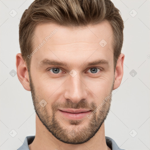 Joyful white young-adult male with short  brown hair and grey eyes