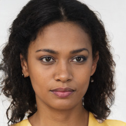 Neutral black young-adult female with long  brown hair and brown eyes