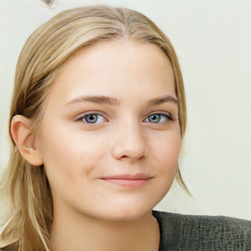 Joyful white child female with long  brown hair and grey eyes