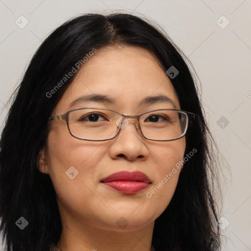 Joyful white adult female with long  brown hair and brown eyes