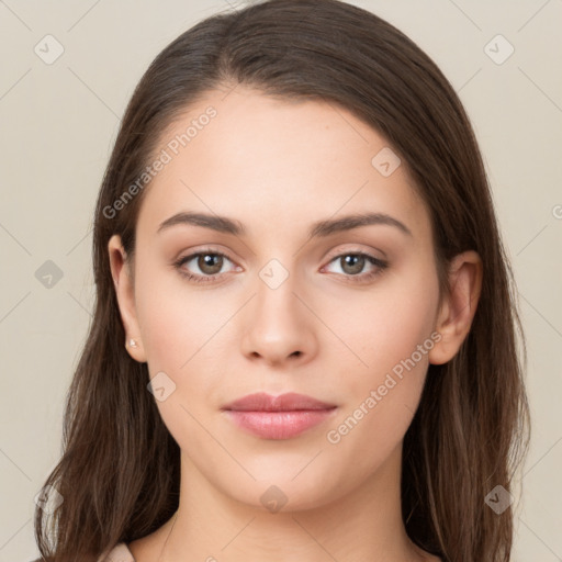 Neutral white young-adult female with long  brown hair and brown eyes