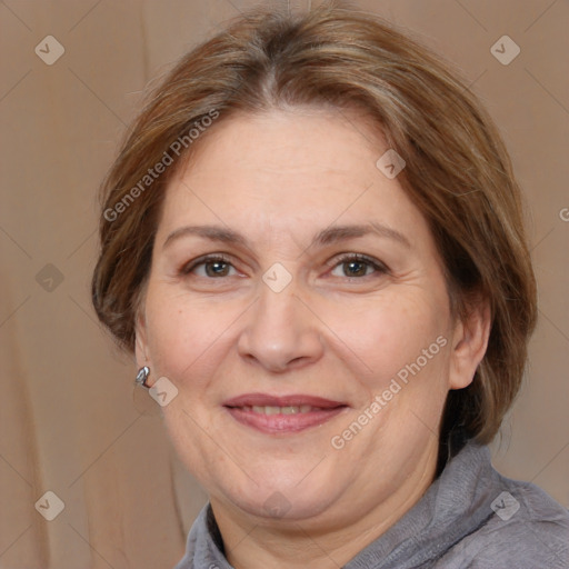 Joyful white adult female with medium  brown hair and brown eyes