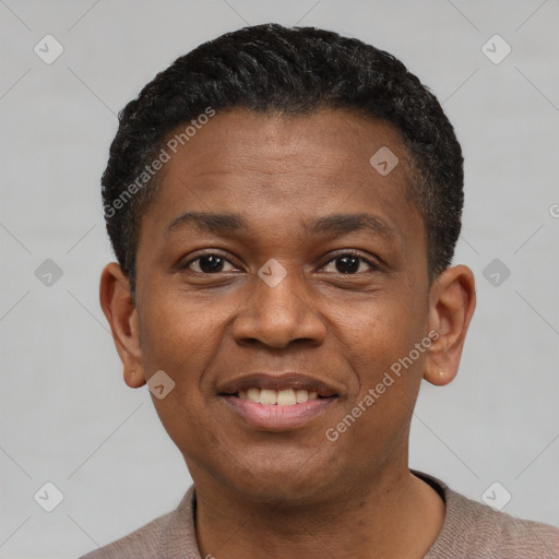 Joyful black young-adult male with short  black hair and brown eyes