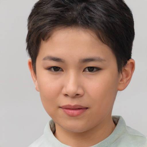 Joyful white child female with short  brown hair and brown eyes