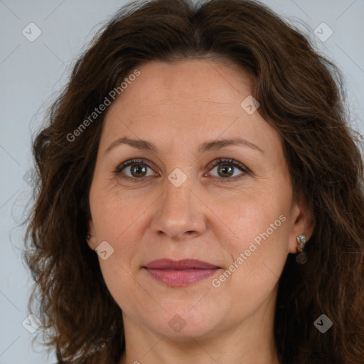 Joyful white adult female with long  brown hair and brown eyes