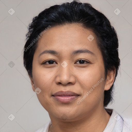 Joyful latino young-adult female with medium  black hair and brown eyes