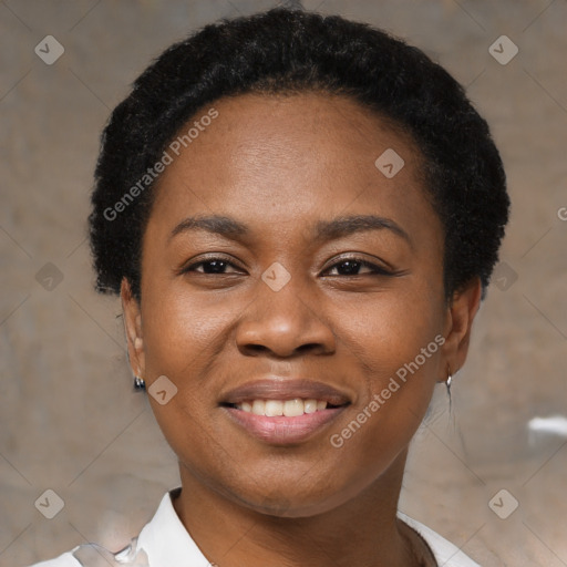 Joyful black young-adult female with short  black hair and brown eyes