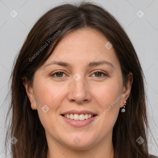 Joyful white adult female with long  brown hair and brown eyes