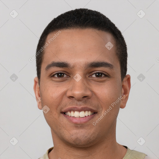 Joyful white young-adult male with short  black hair and brown eyes