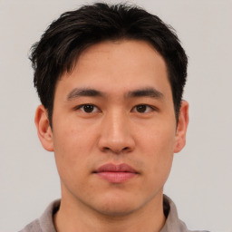 Neutral asian young-adult male with short  brown hair and brown eyes