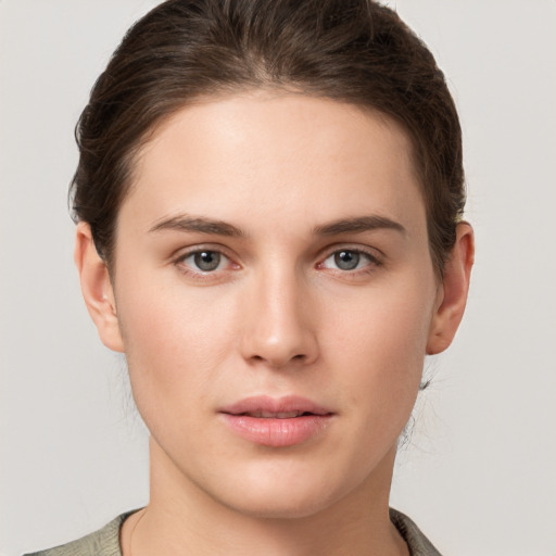 Neutral white young-adult female with short  brown hair and brown eyes